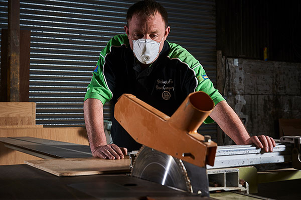 Man cutting wood