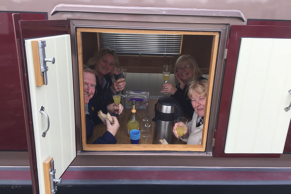 People enjoying drinks on their boat